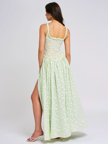 Back view of green maxi dress showing corset lacing detail
