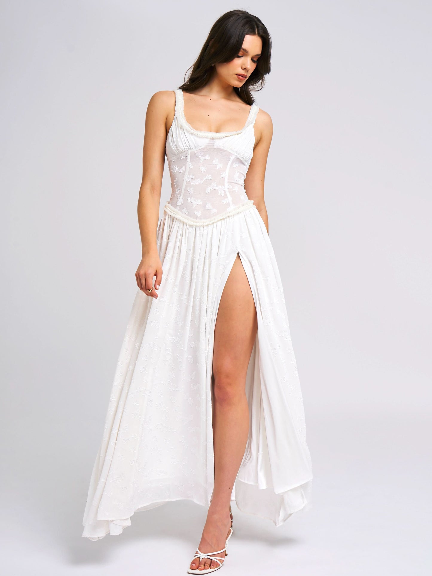 White maxi dress with embroidered corset bodice and high slit