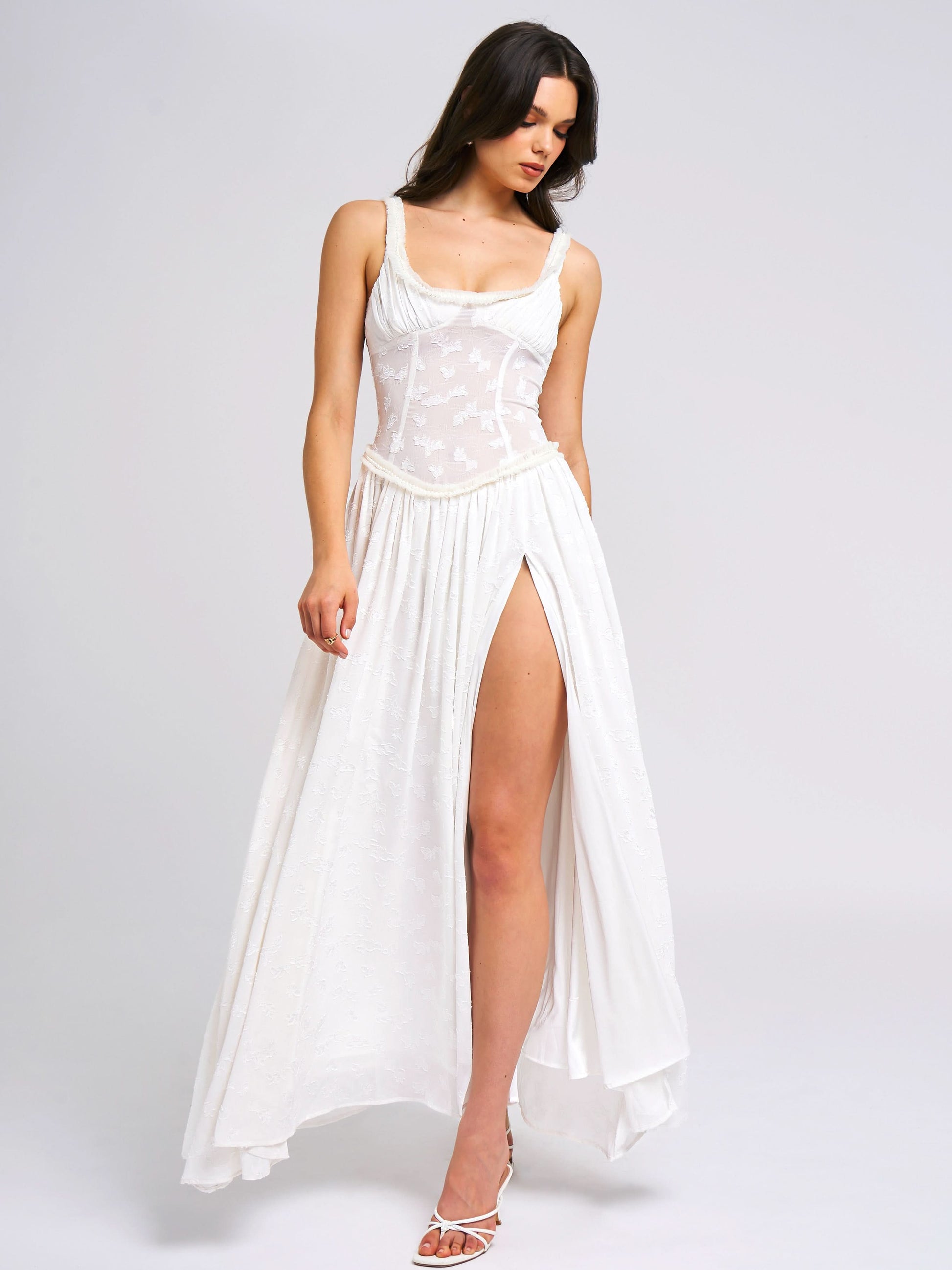 White maxi dress with embroidered corset bodice and high slit