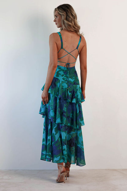 Back view of teal ruffle midi dress showing crisscross straps and layered ruffled skirt