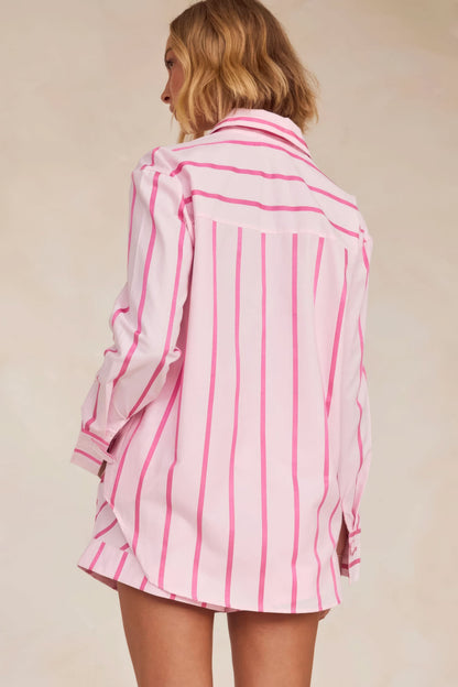 Back view of pink striped knit shirt with matching pleated skirt
