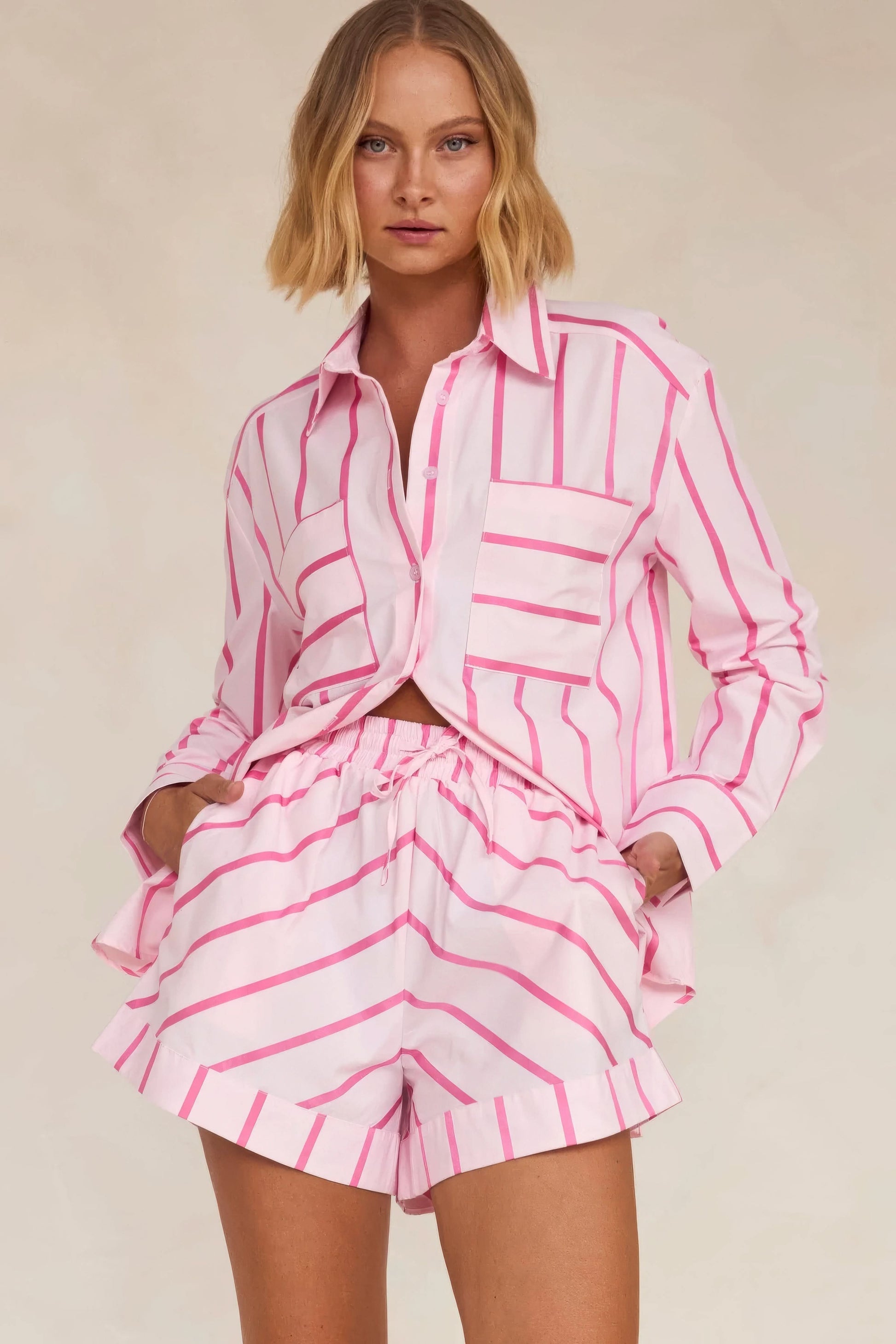 Pink and white striped knit shirt and pleated skirt set