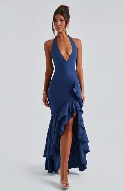 Navy halter maxi dress with cascading ruffled asymmetrical hem and deep V neckline