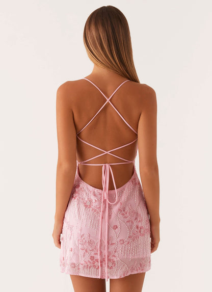 Pale pink sequin mini dress back view with lace-up strappy detail