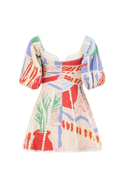 Back flat lay of mini dress displaying corset waist and white scalloped hem trim