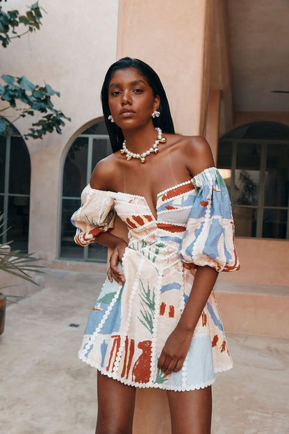 Off-shoulder mini dress with multicolor abstract print and white scalloped trim