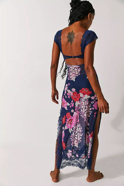 Back view of navy floral maxi slip dress with lace trim and open back design