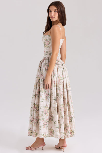 Back view of floral midi dress with thin straps and full pleated skirt
