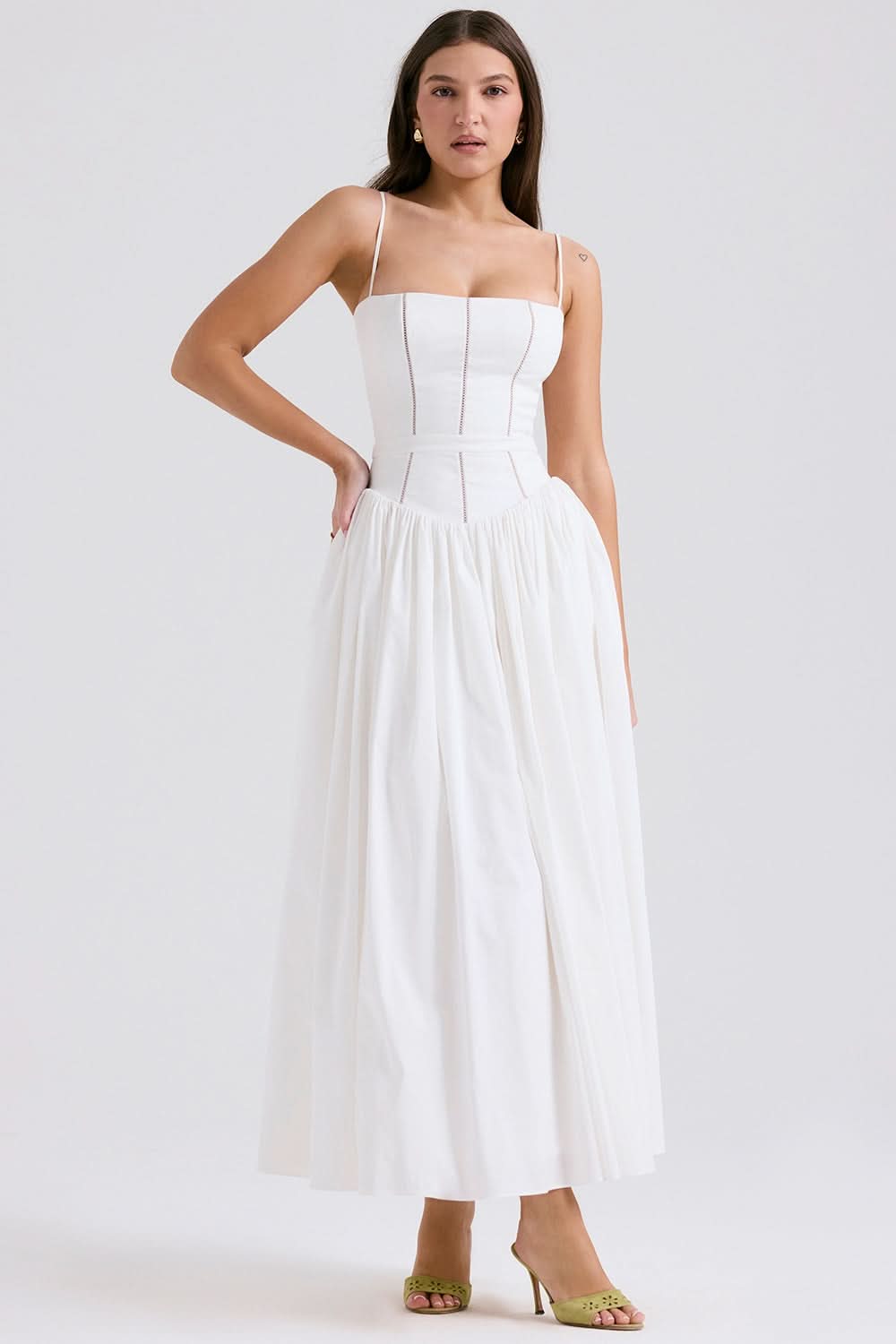 White midi dress with structured bodice and pleated skirt front view