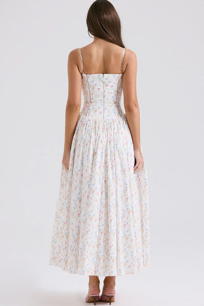 Back view of cream floral midi dress showing fitted waist and full skirt