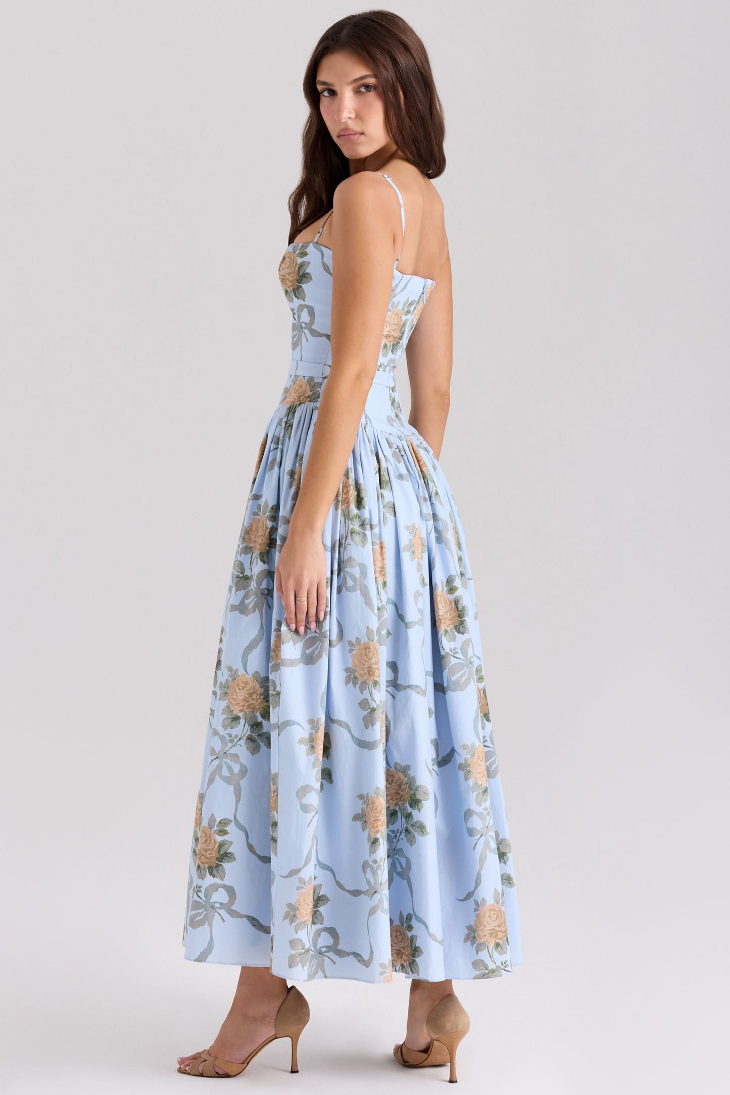 Back view of light blue floral midi dress with spaghetti straps and pleated skirt