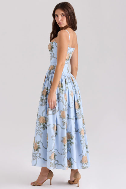 Back view of light blue floral midi dress with spaghetti straps and pleated skirt