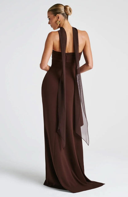 Back view of brown maxi dress with open back and flowing sheer overlay