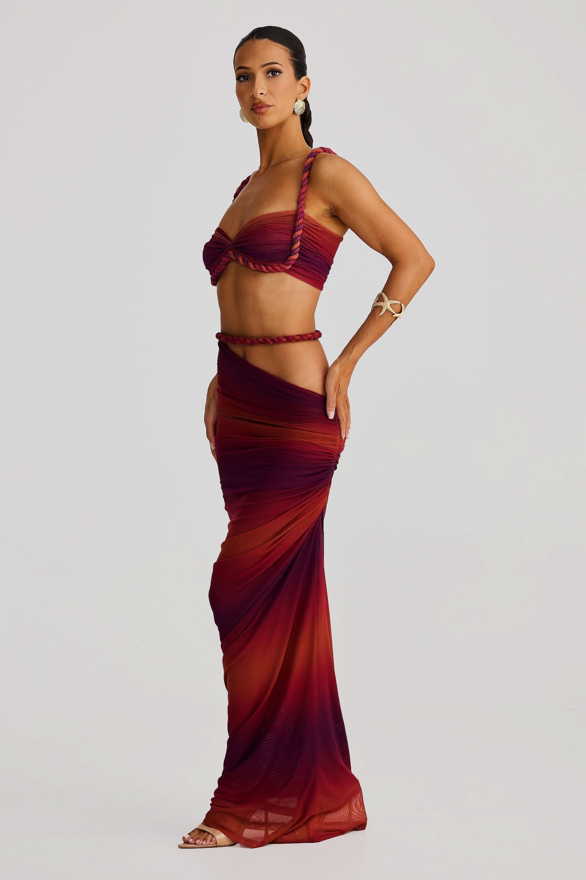 Side view of burgundy ombre maxi set with rope-trimmed details